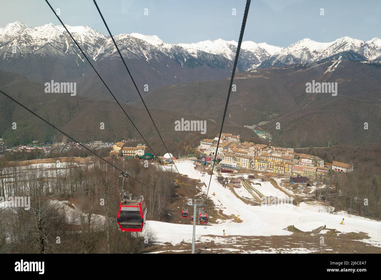 Sochi, Russia - April 23, 2022: Scenic mountain landscape with cable car of Krasnaya Polyana resort. Cable lift cabins with a view of the Caucasus Mou Stock Photo