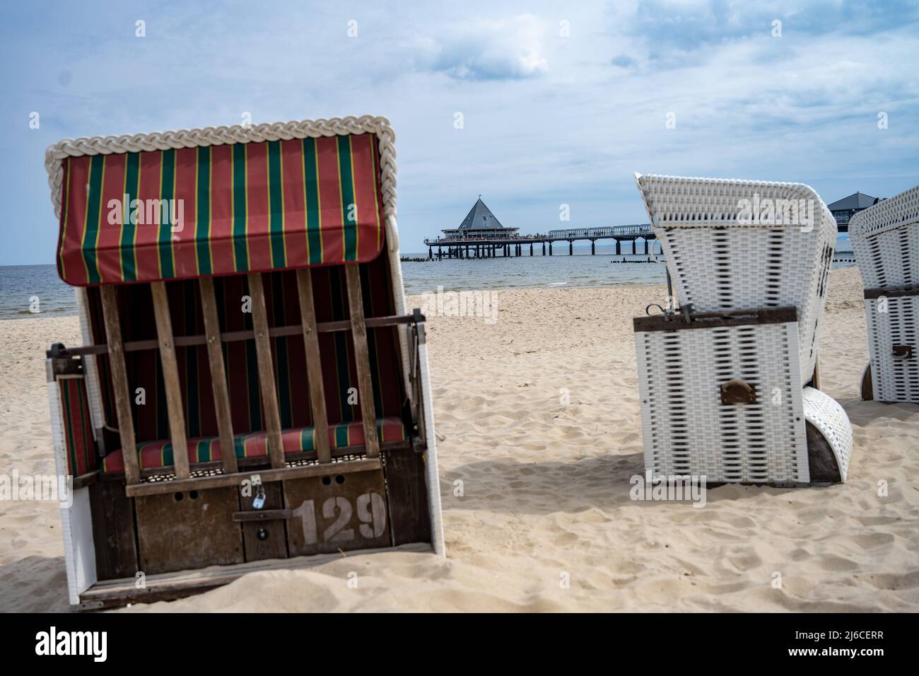 30 April 2022, Mecklenburg-Western Pomerania, Heringsdorf: Tourists are  walking on the beach of the island of Usedom in sunny weather in the Baltic  resort of Heringsdorf. Photo: Stefan Sauer/dpa Stock Photo -
