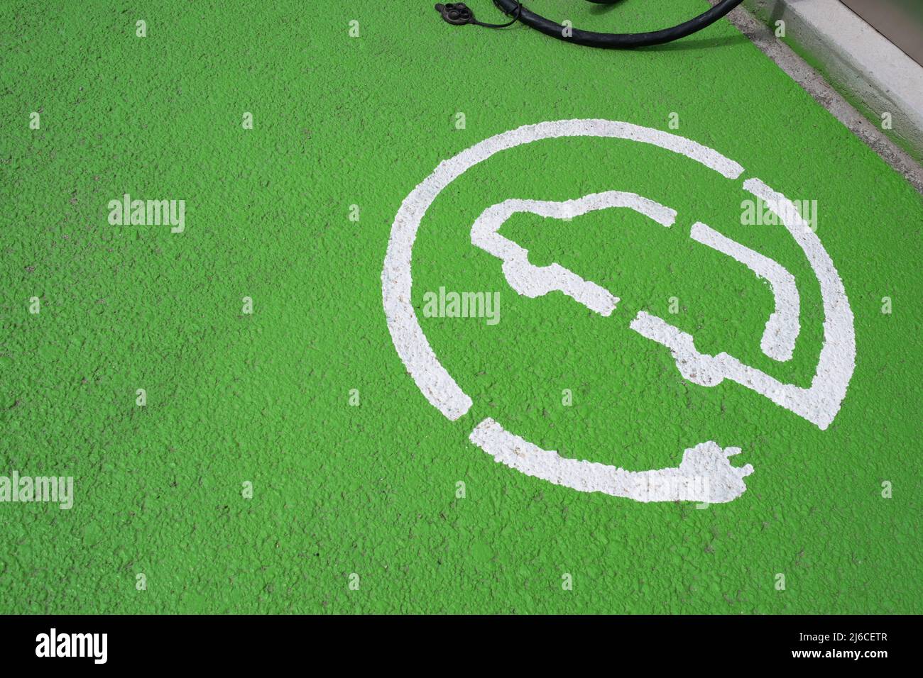 High angle view of parking sign for electrical cars. Recharge point signal for electric cars in the city of Blanes the Spanish region of Catalonia. Stock Photo