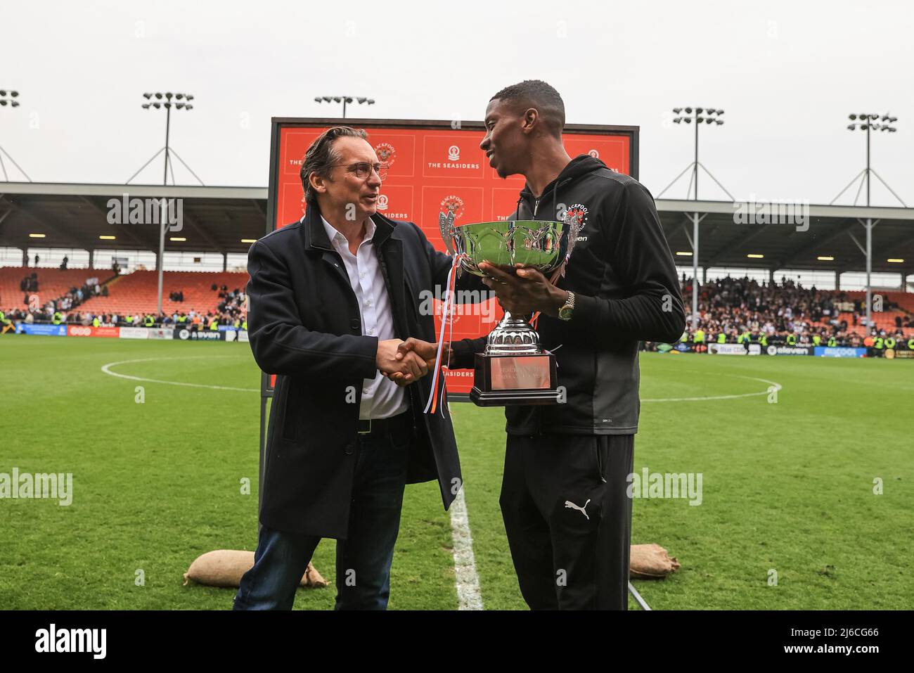 Simon Sadler owner of Blackpool presents the player of the year trophy