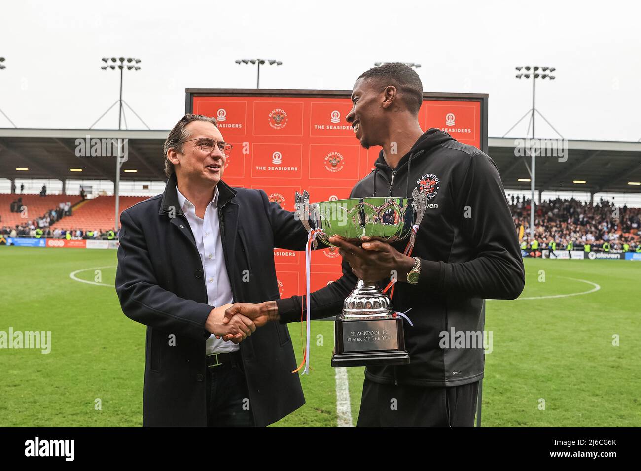 Simon Sadler owner of Blackpool presents the player of the year trophy