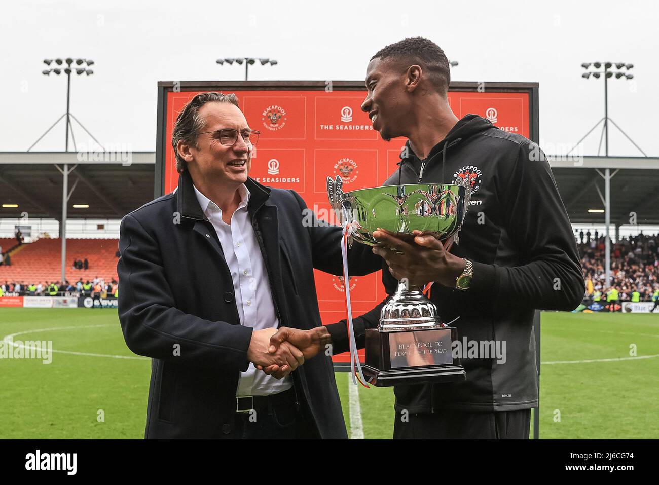 Simon Sadler owner of Blackpool presents the player of the year trophy