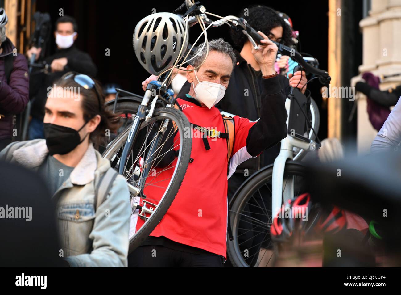 A cyclist carries his bicycle out of the Cathedral after attending the 24th annual blessing of the bicycles inside The Cathedral of St. John The Divine in New York, NY, April 30, 2022. The annual blessing is ahead of New York City’s 5 Borough bike tour that takes place on Sunday May 1. (Photo by Anthony Behar/Sipa USA) Stock Photo