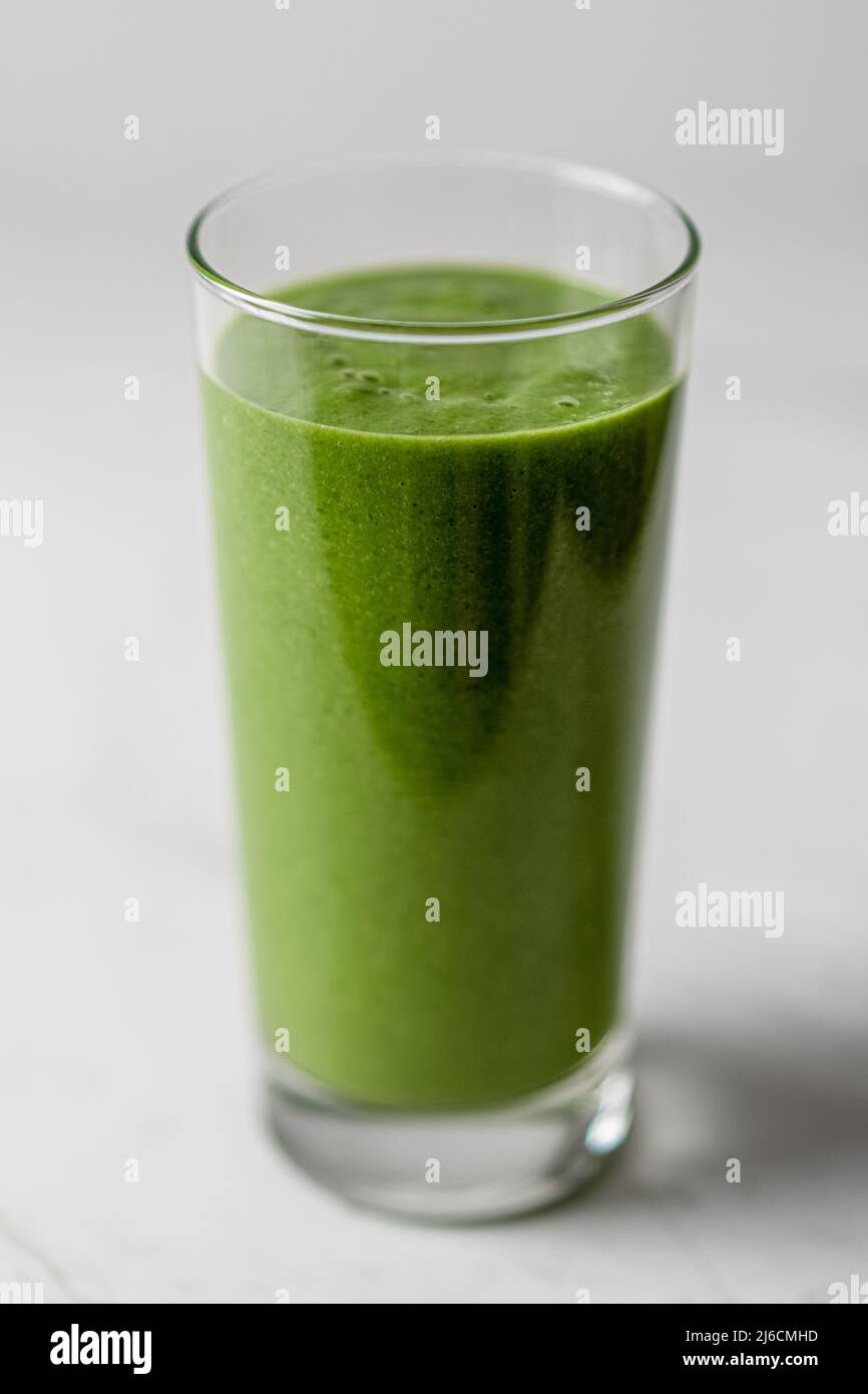Healthy Detox Green Kale Smoothie Glass with Spirulina Stock Photo