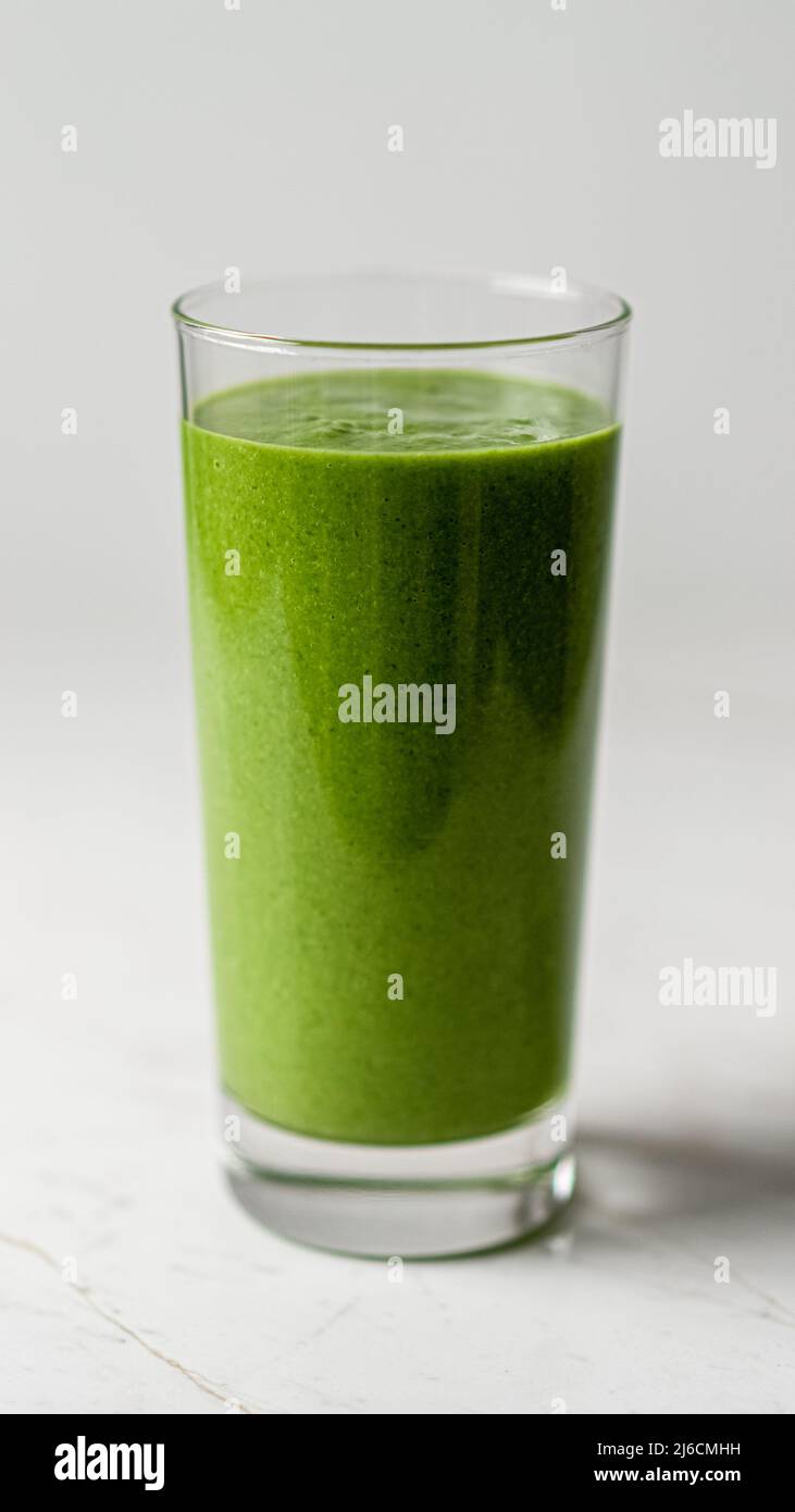Healthy Detox Green Kale Smoothie Glass with Spirulina Stock Photo