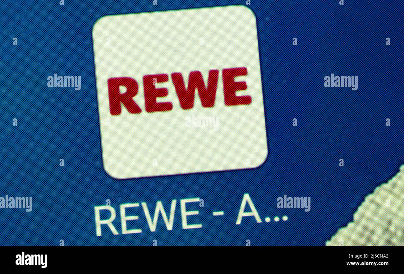 In this photo illustration, the Rewe application logo is displayed on a
