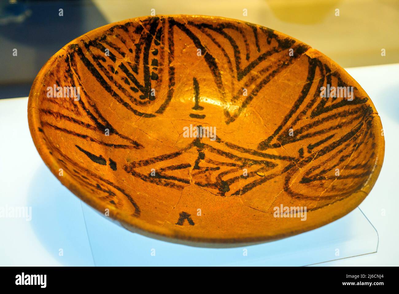 Deep dish Ceramic with honey-coloured glaze decorated with manganese Second half of the 10th century. Museum of Madinat al-Zahra (the shining city) - Cordoba, Spain Stock Photo