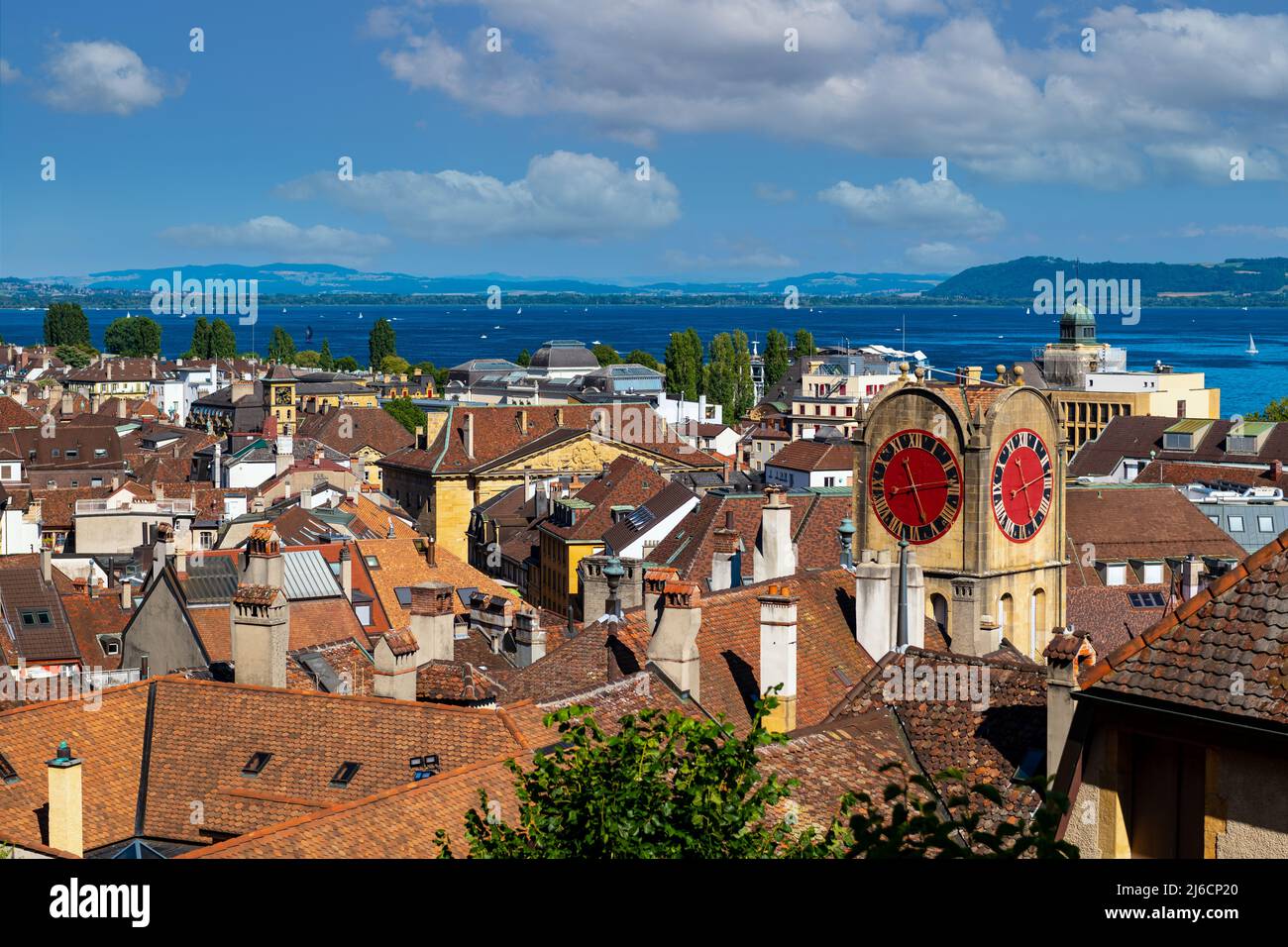 View of the old town of Neuchâtel, Lake Neuchâtel and the Alps. Stock Photo