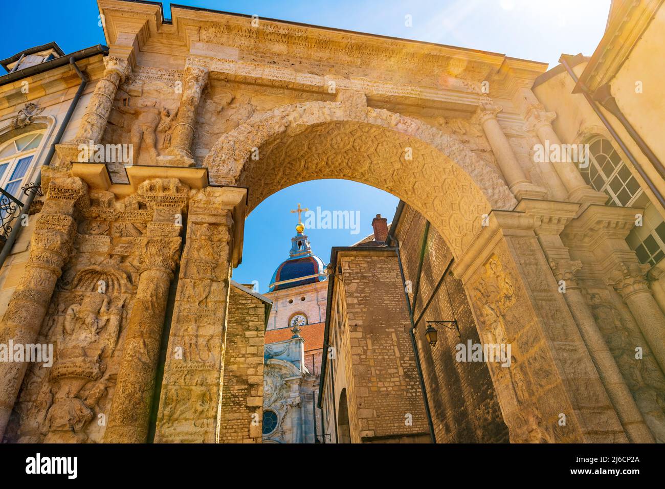 The Porte Noire archway in Besancon, with St. Jean Cathedral in the background. Stock Photo