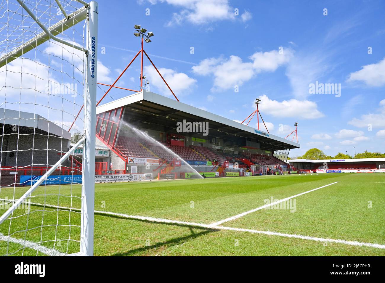 Watering the pitch on a beautiful sunny day before the Sky Bet League Two match between Crawley Town and Leyton Orient at the People's Pension Stadium  , Crawley ,  UK - 30th April 2022 Editorial use only. No merchandising. For Football images FA and Premier League restrictions apply inc. no internet/mobile usage without FAPL license - for details contact Football Dataco Stock Photo