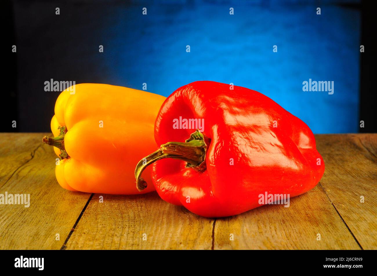 Red and yellow pepper on white background Stock Photo - Alamy