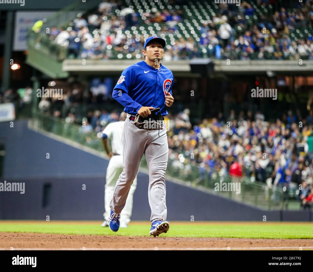 April 29, 2022 - Chicago Cubs right fielder Seiya Suzuki (27) runs off the field in between innings during MLB Baseball action between Chicago and Milwaukee at Miller Park in Milwaukee, WI. Stock Photo