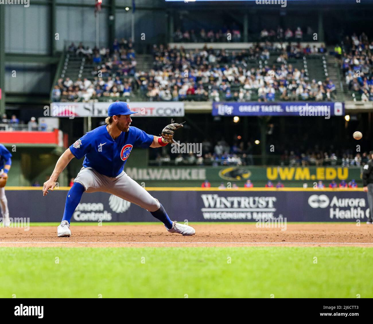 April 29, 2022 - Chicago Cubs third baseman Patrick Wisdom (16) eyes a bouncer to third during MLB Baseball action between Chicago and Milwaukee at Miller Park in Milwaukee, WI. Stock Photo