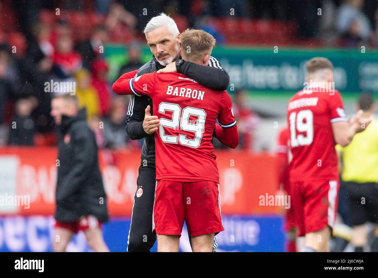 Aberdeen, Scotland, UK. 30th April 2022:   Aberdeen Football Club, Aberdeen, Scotland: Scottish Premier League football, Aberdeen versus Dundee : Aberdeen manager Jim Goodwin hugs Connor Barron at the end of the match Credit: Action Plus Sports Images/Alamy Live News Stock Photo