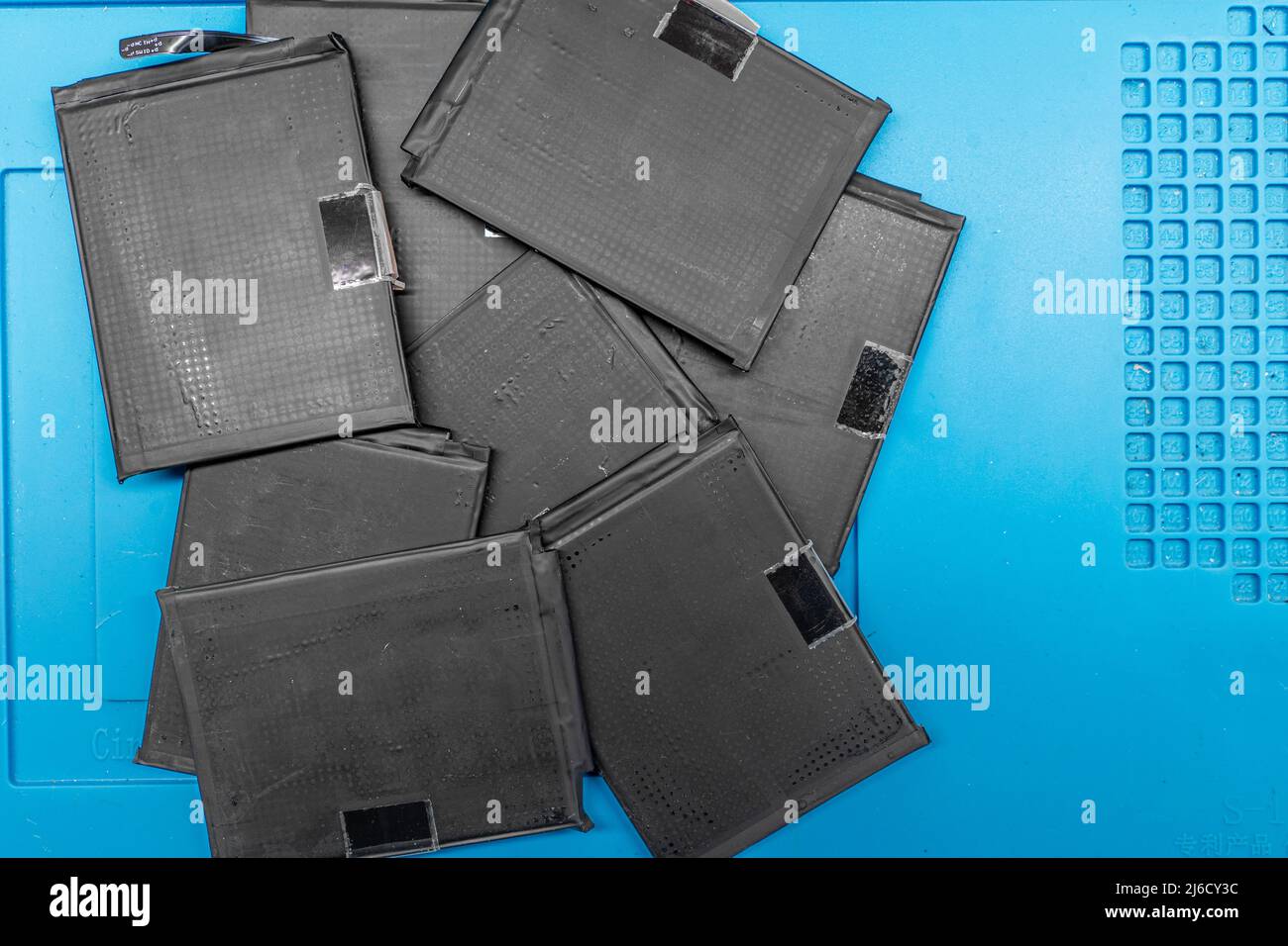 a stack of mobile phone batteries in the workshop Stock Photo