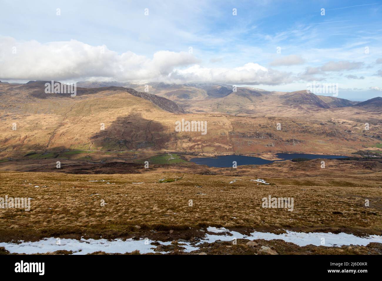 Looking towards the cloud topped Carneddau and Glyderau mountain ranges from the side of Moel Siabod Stock Photo