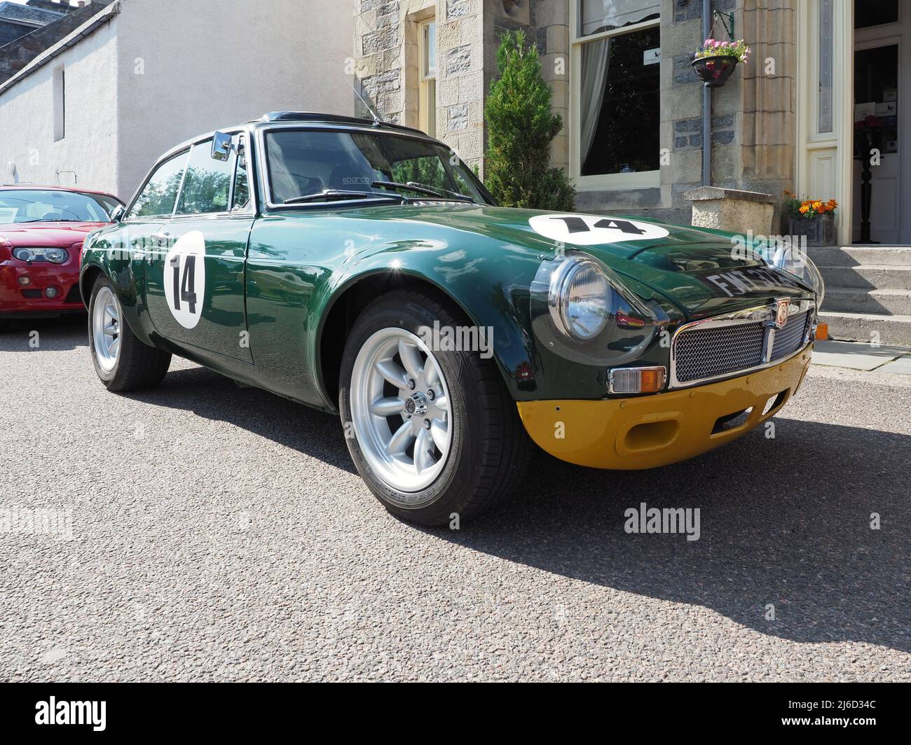 MG MGB GT, 1.8lt, made in 1970, in British Racing Green with a yellow chin spoiler. This one is used in racing. Stock Photo