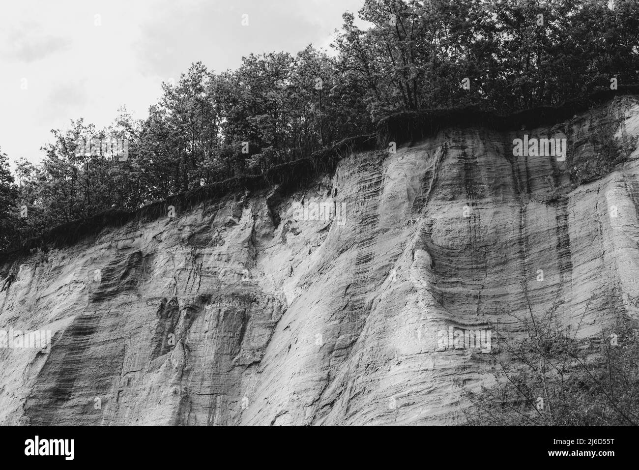 Wall made of sand, sand cliff. High quality photo. High quality photo Stock Photo