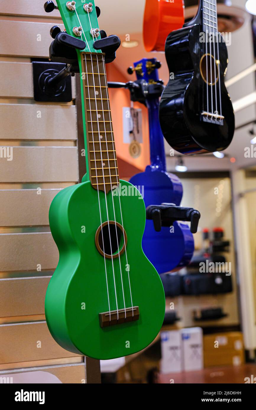 Guitars on display in music instruments store in a mall Stock Photo Alamy