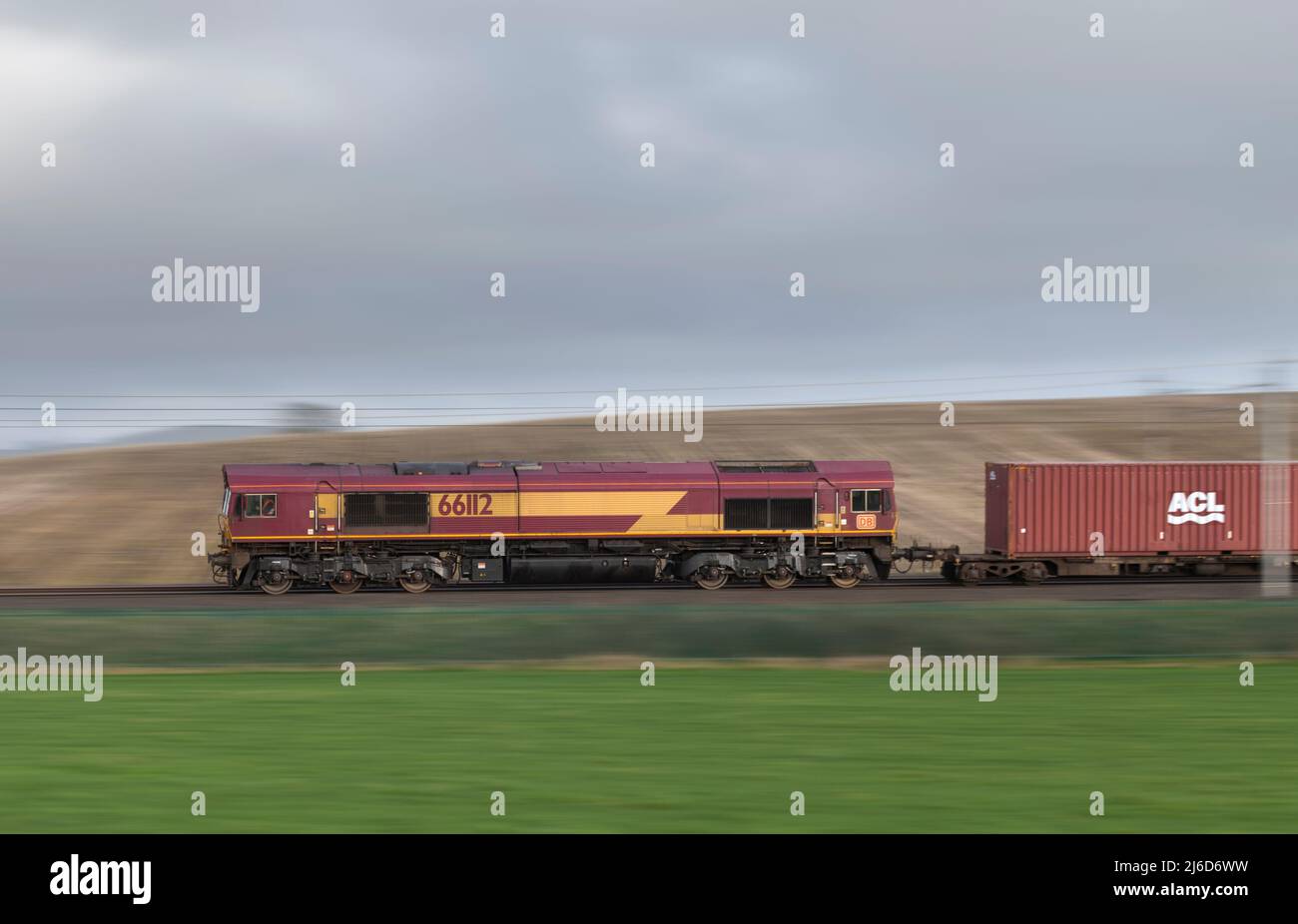 DB Cargo Rail UK class 66 diesel 66112 hauling a container