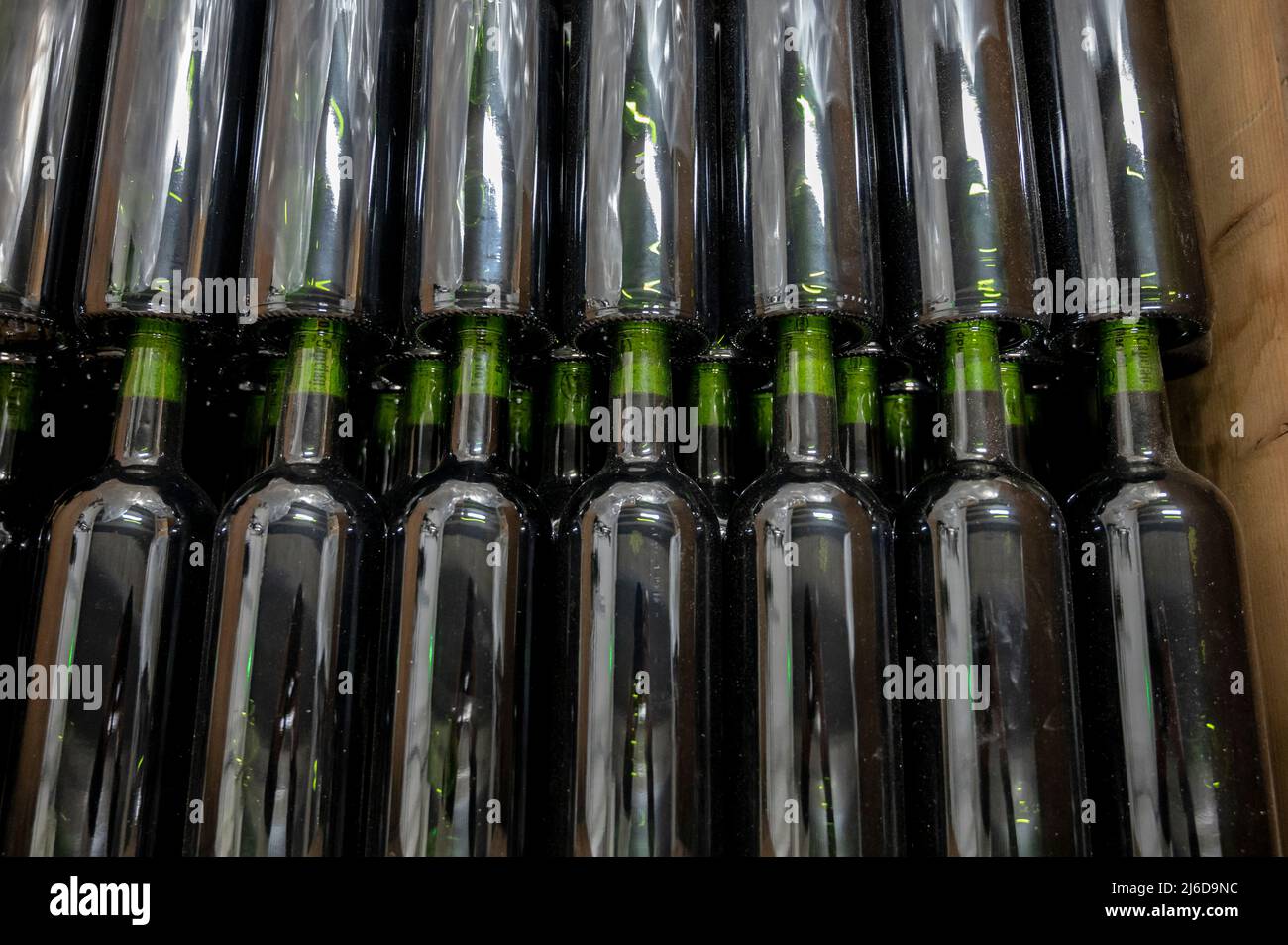 Bottles of wine without labels in box, producing of red, rose and white