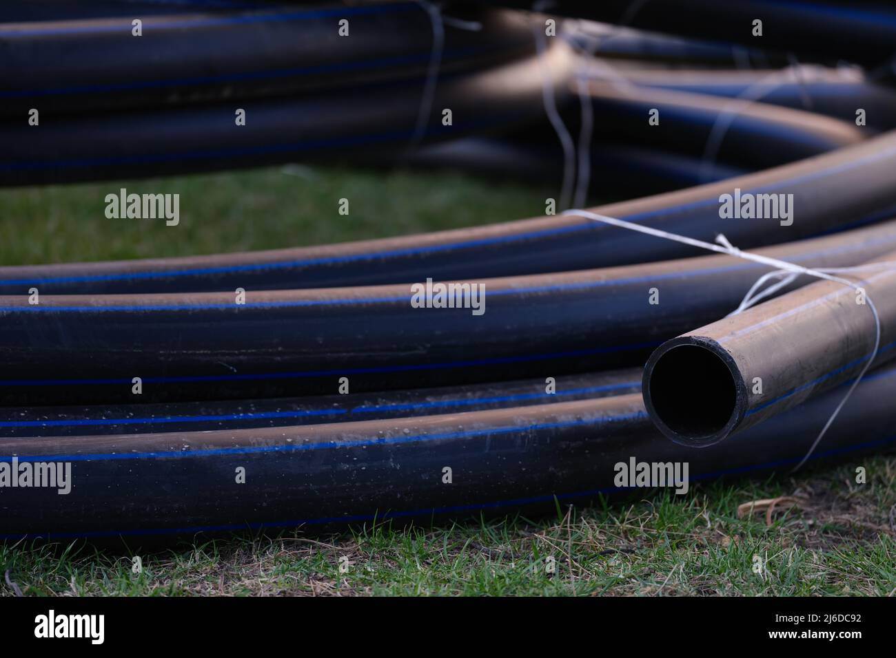 Large black plastic pipes for water supply closeup Stock Photo Alamy