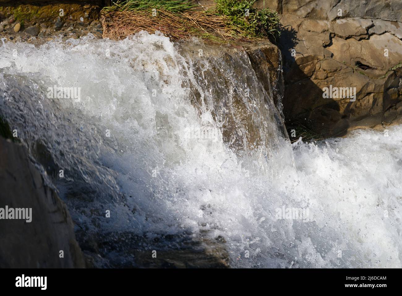 Cascade of waterfalls among the stones closeup Stock Photo