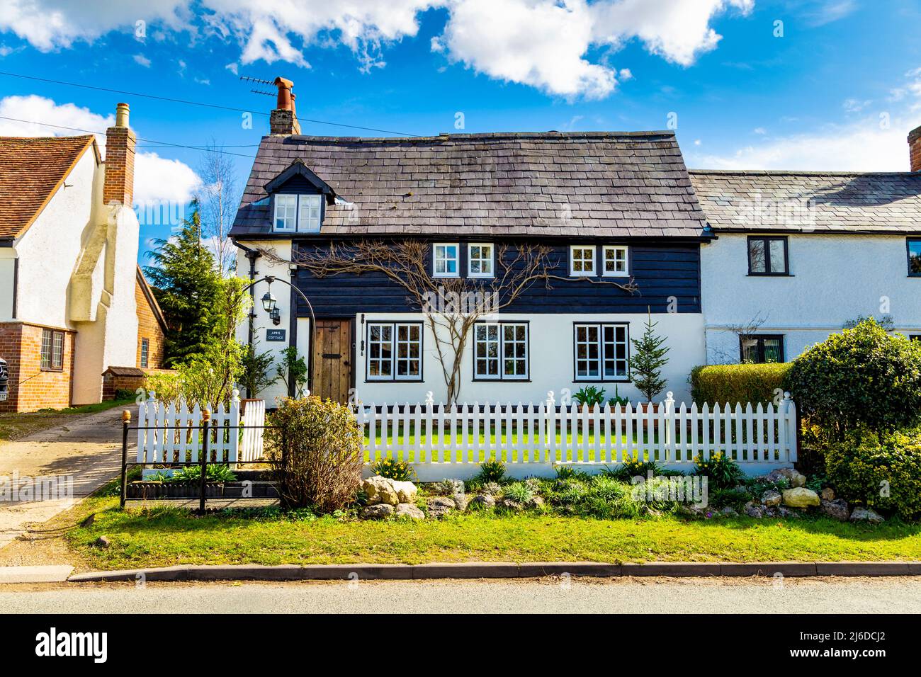 Charming cottage with white picket fence in the village of Great Wymondley, Hertfordshire, UK Stock Photo