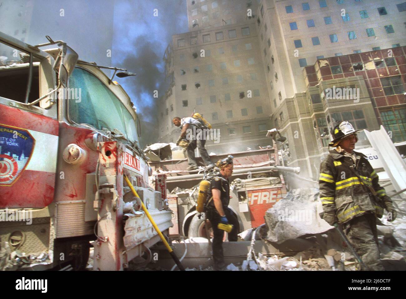 New York City fire fighters amid debris following September 11th terrorist attack on World Trade Center, New York City, New York, USA, Unidentified Artist Stock Photo