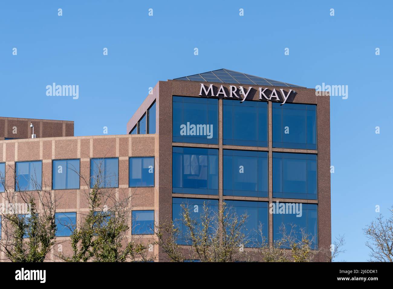 Addison, Texas, USA - March 19, 2022: Mary Kay’s sign on the building at its corporate headquarters in Addison, Texas, USA. Stock Photo
