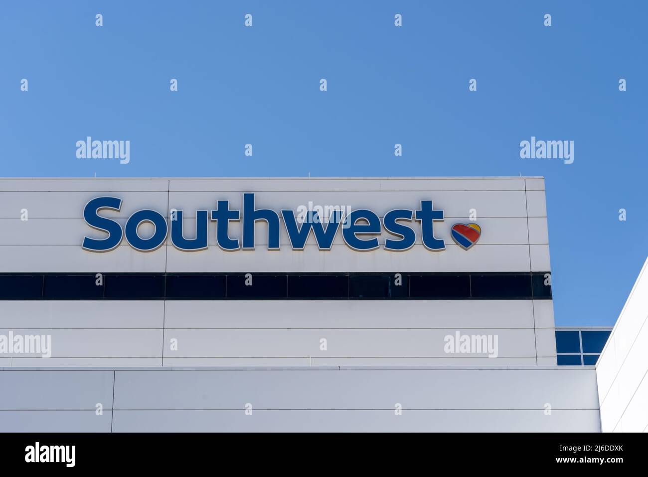 Dallas, TX, USA - March 20, 2022: Closeup of Southwest sign on its headquarters building in Dallas, Texas, USA. Stock Photo