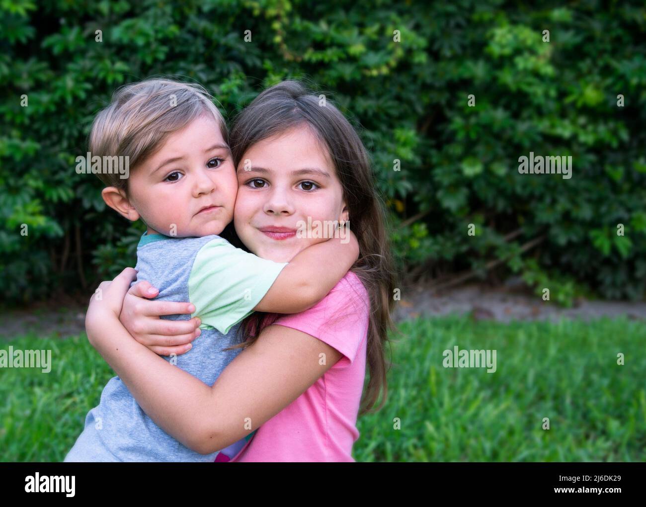 Brother and sister hugging Stock Photo