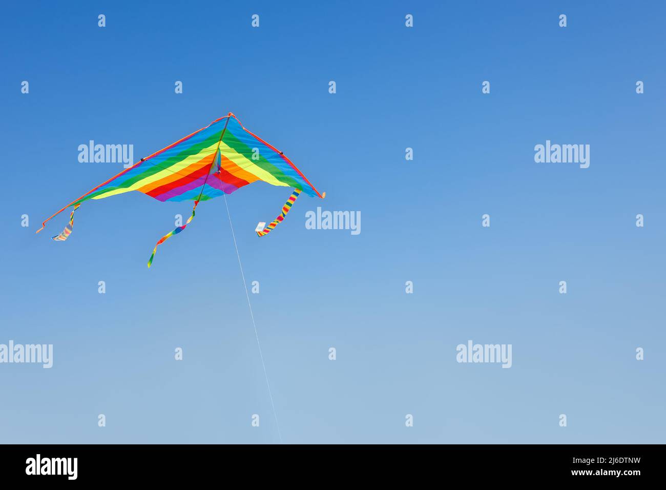 kite flying in the clear blue sky Stock Photo