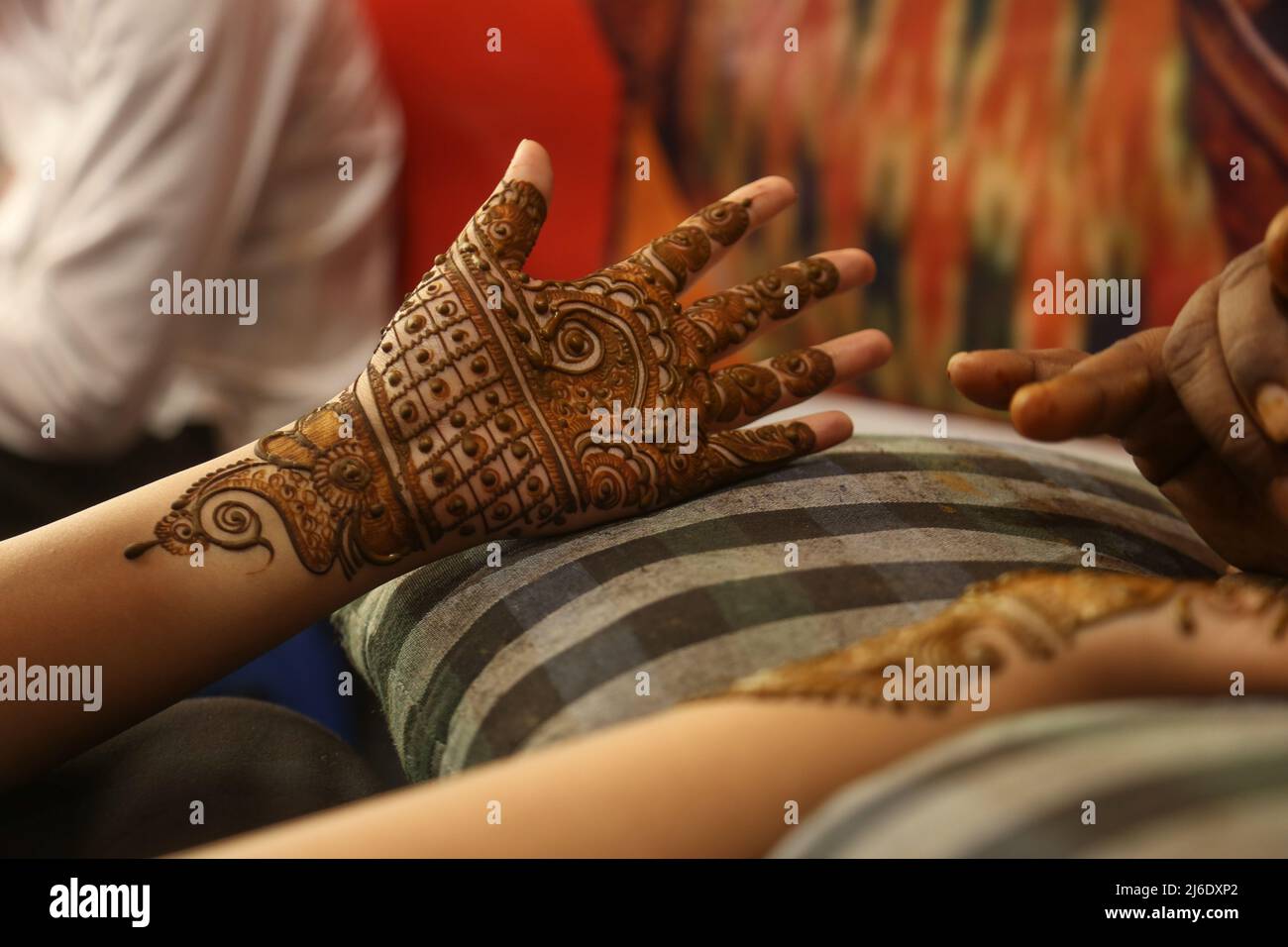 An Indian Artists Applies Henna On The Hands Of Kashmiri Muslim Girls An indian artists applies henna on the hands of kashmiri muslim girls