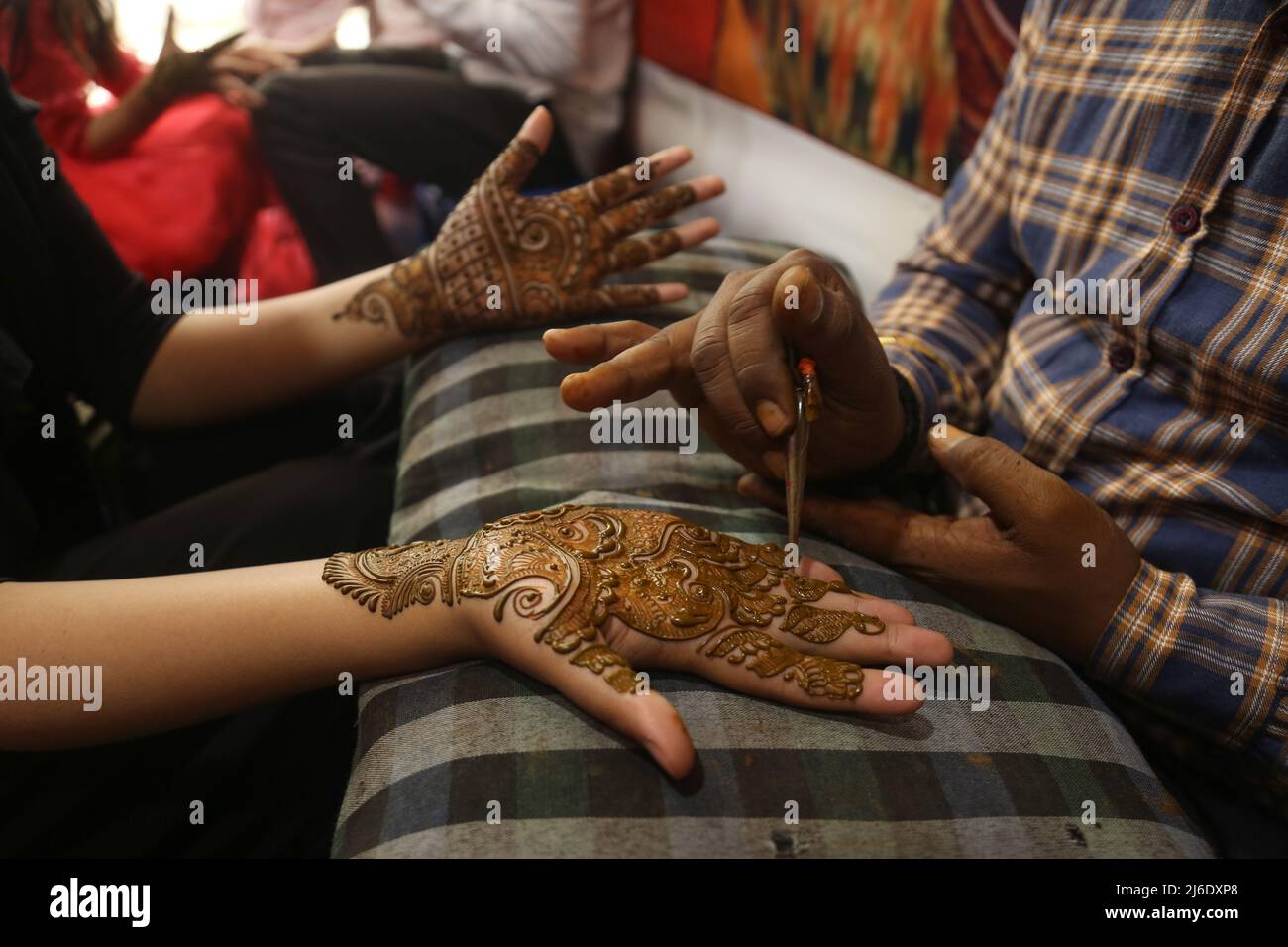 An Indian Artists Applies Henna On The Hands Of Kashmiri Muslim Girls An indian artists applies henna on the hands of kashmiri muslim girls