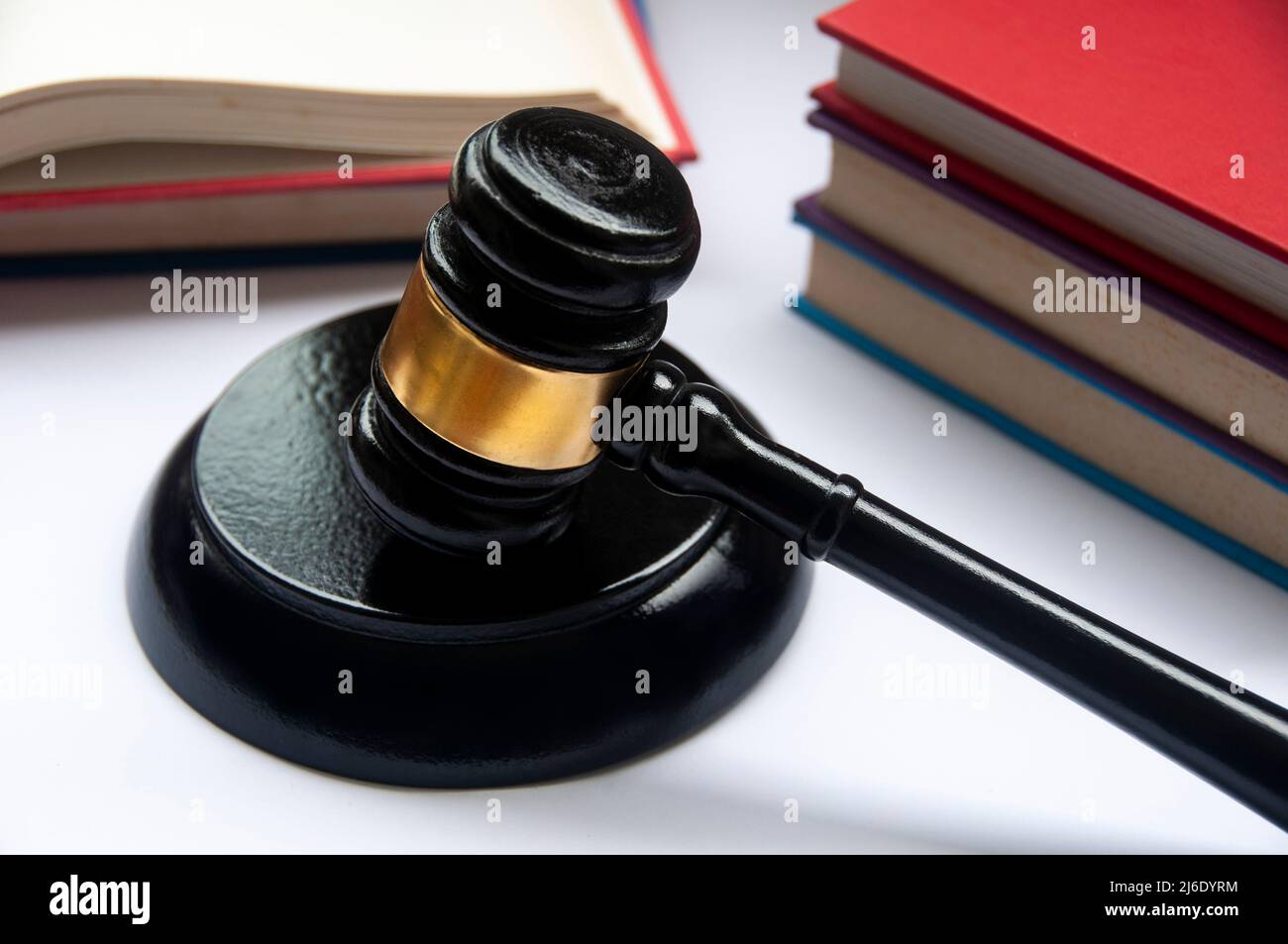 Lawyer gavel on white cover with books background. Law concept Stock Photo