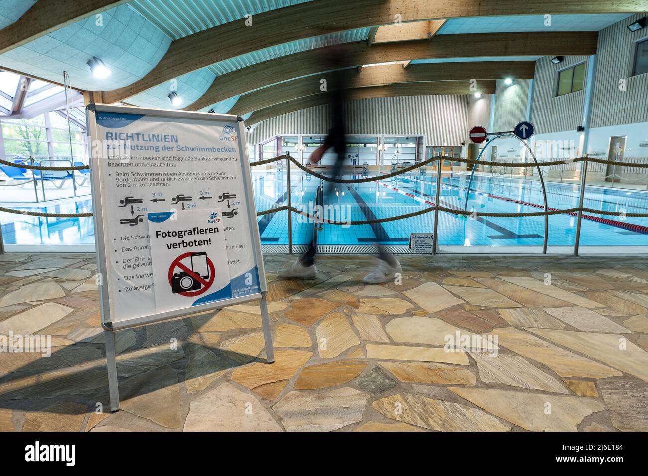 Gottingen, Germany. 01 May 2022, Lower Saxony, Göttingen: A stand with  pictograms and the inscription "Photography prohibited!" is located at the  swimmer's pool in the indoor swimming pool "Badeparadies Eiswiese". From  01.05.2022,