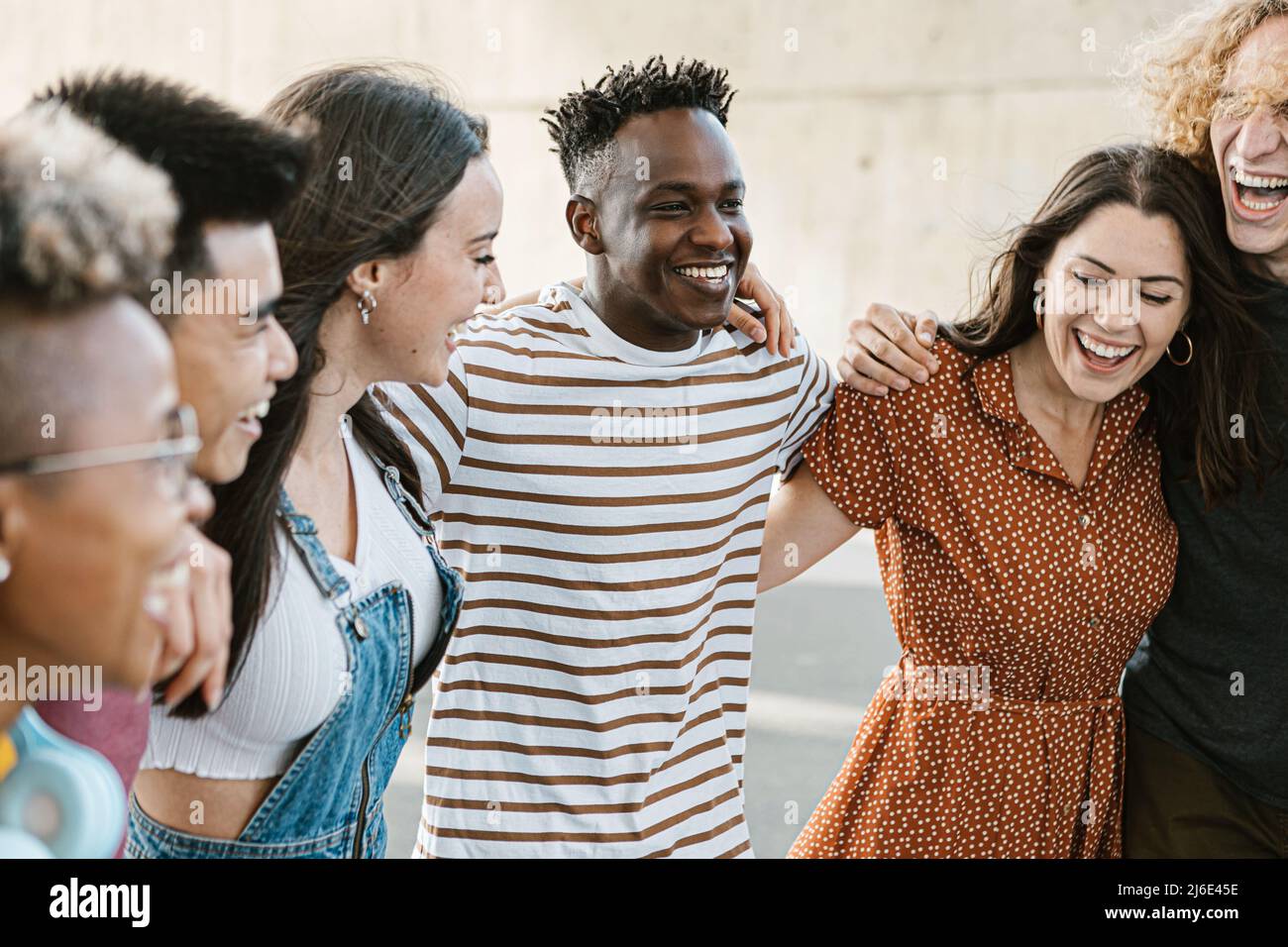 Group of happy multiracial young best friends laughing and having fun together Stock Photo