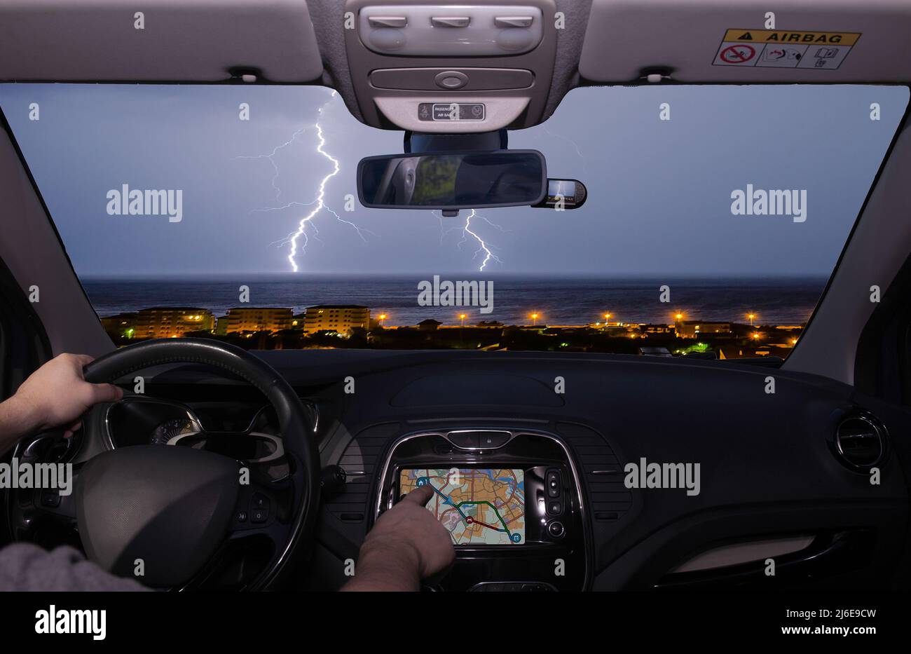 Driving a car while using the touch screen of a GPS navigation system