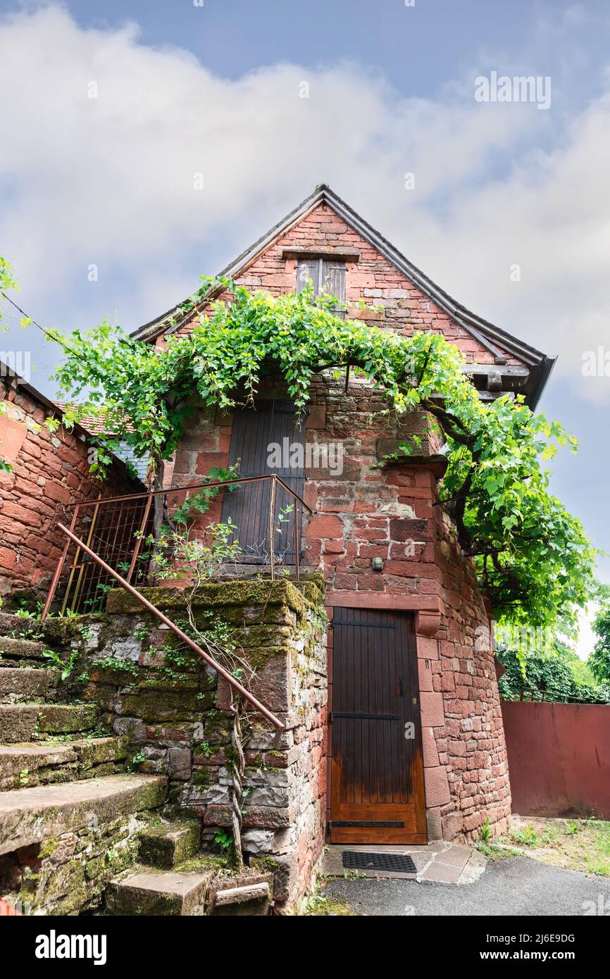 The Railing Medieval Medieval stone staircase with metal railings leads to entrance of small ...