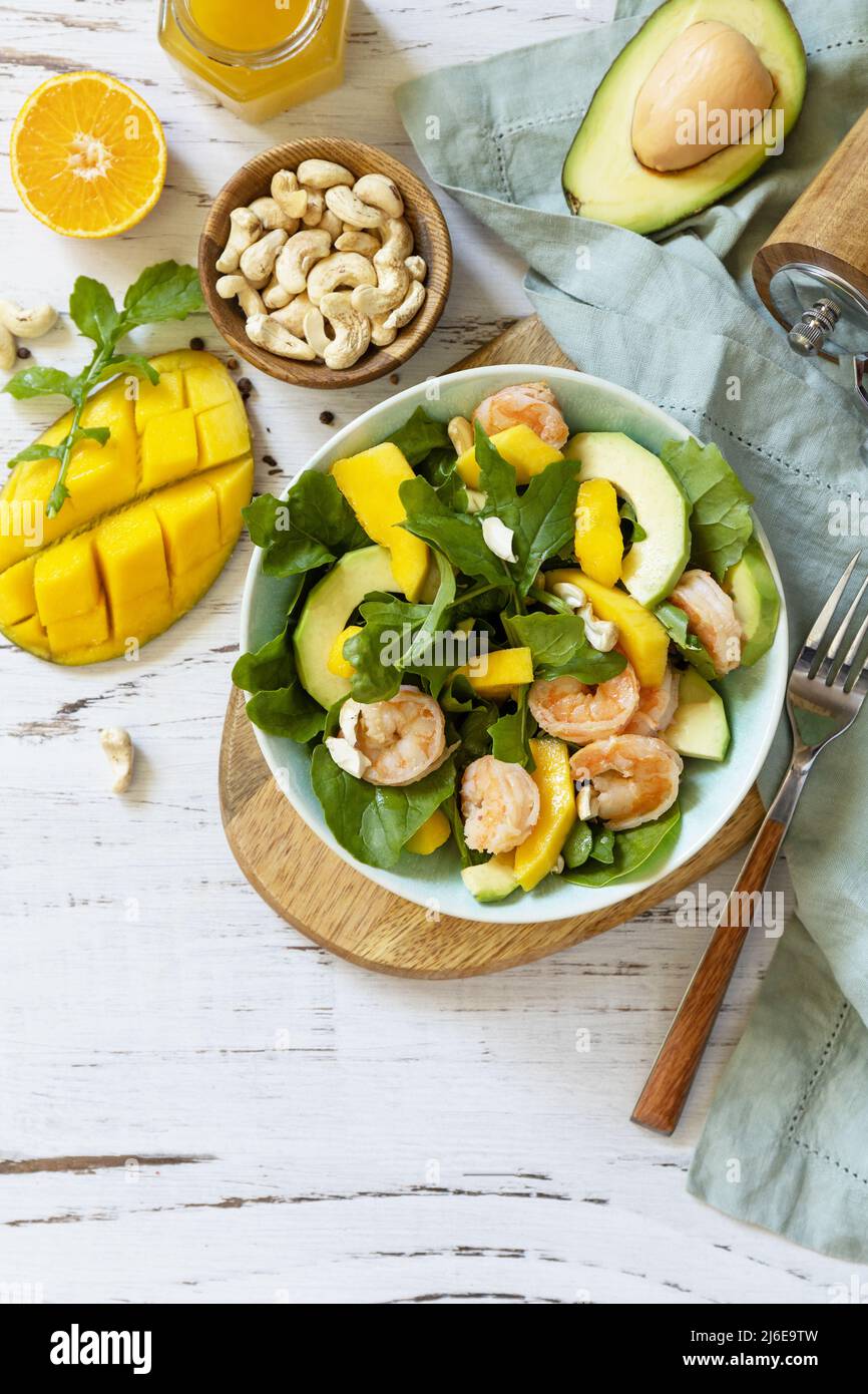 Vegetarian vegan healthy food. Salad with arugula, mango, avocado
