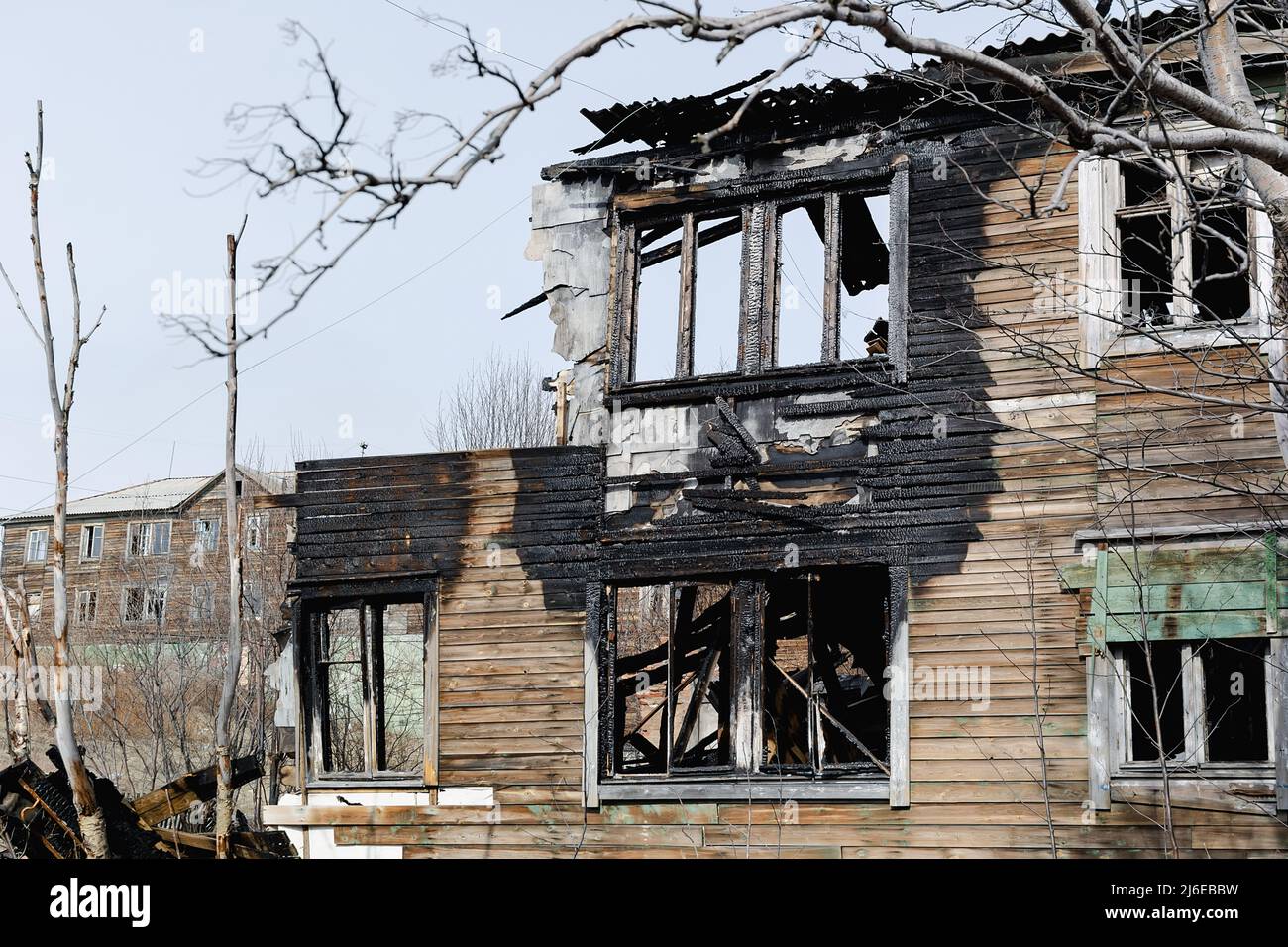 The old wooden damaged burneddown house front view Stock Photo Alamy