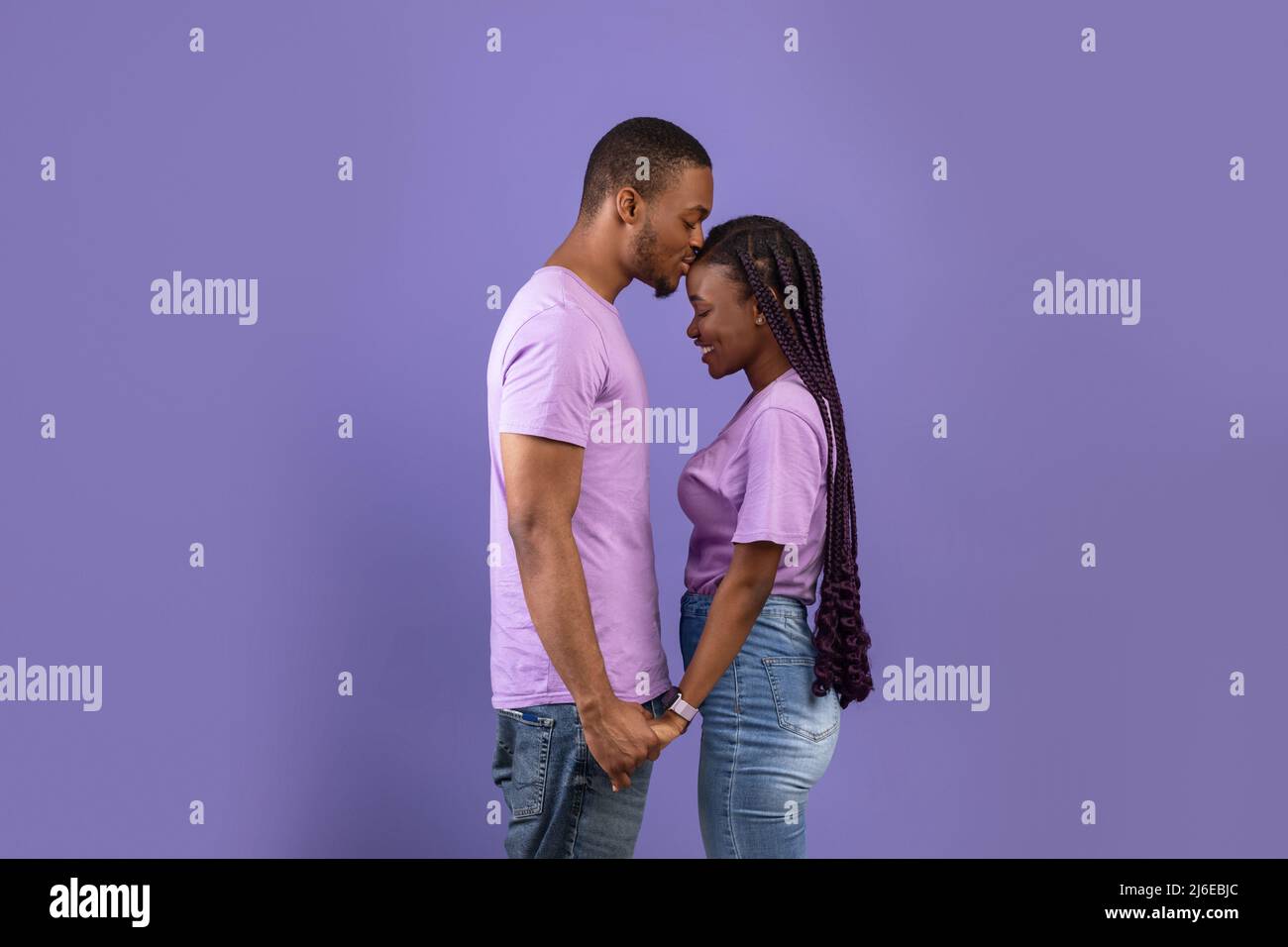African American man kissing his woman at studio Stock Photo