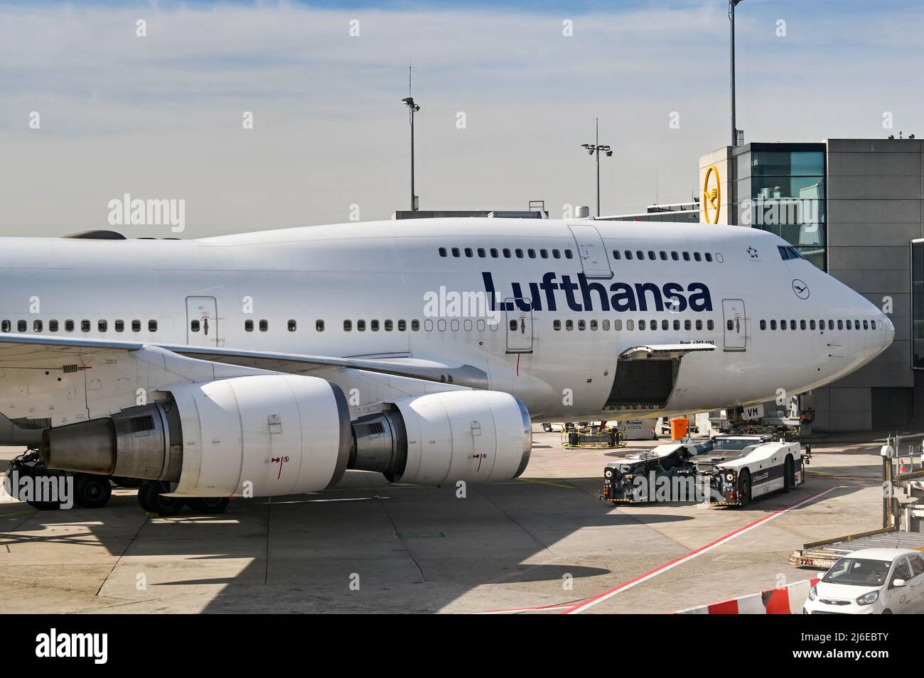 Frankfurt, Germany - April 2022: Boeing 747 long haul jet operated by German airline Lufthansa parked at the airport terminal in Franfkurt Stock Photo