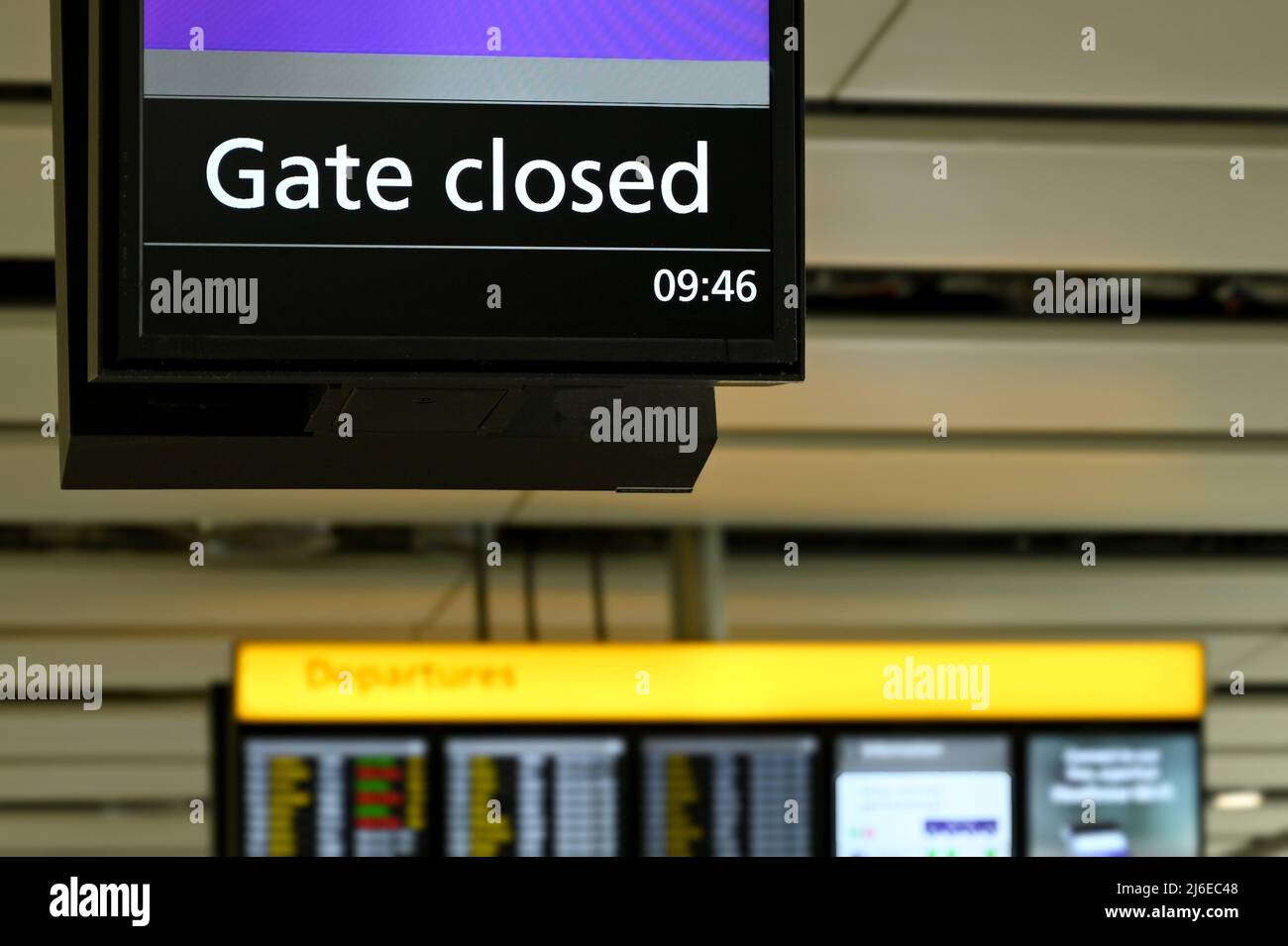 Electronic display in an airport terminal showing passengers the gate