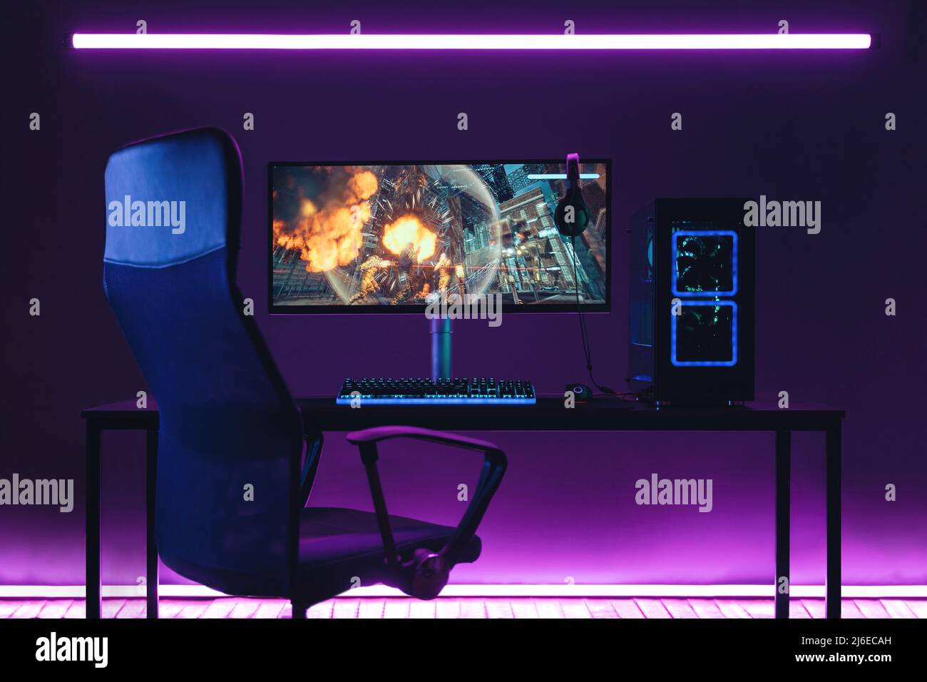 Empty pro gaming home studio in neon coloured room Stock Photo - Alamy