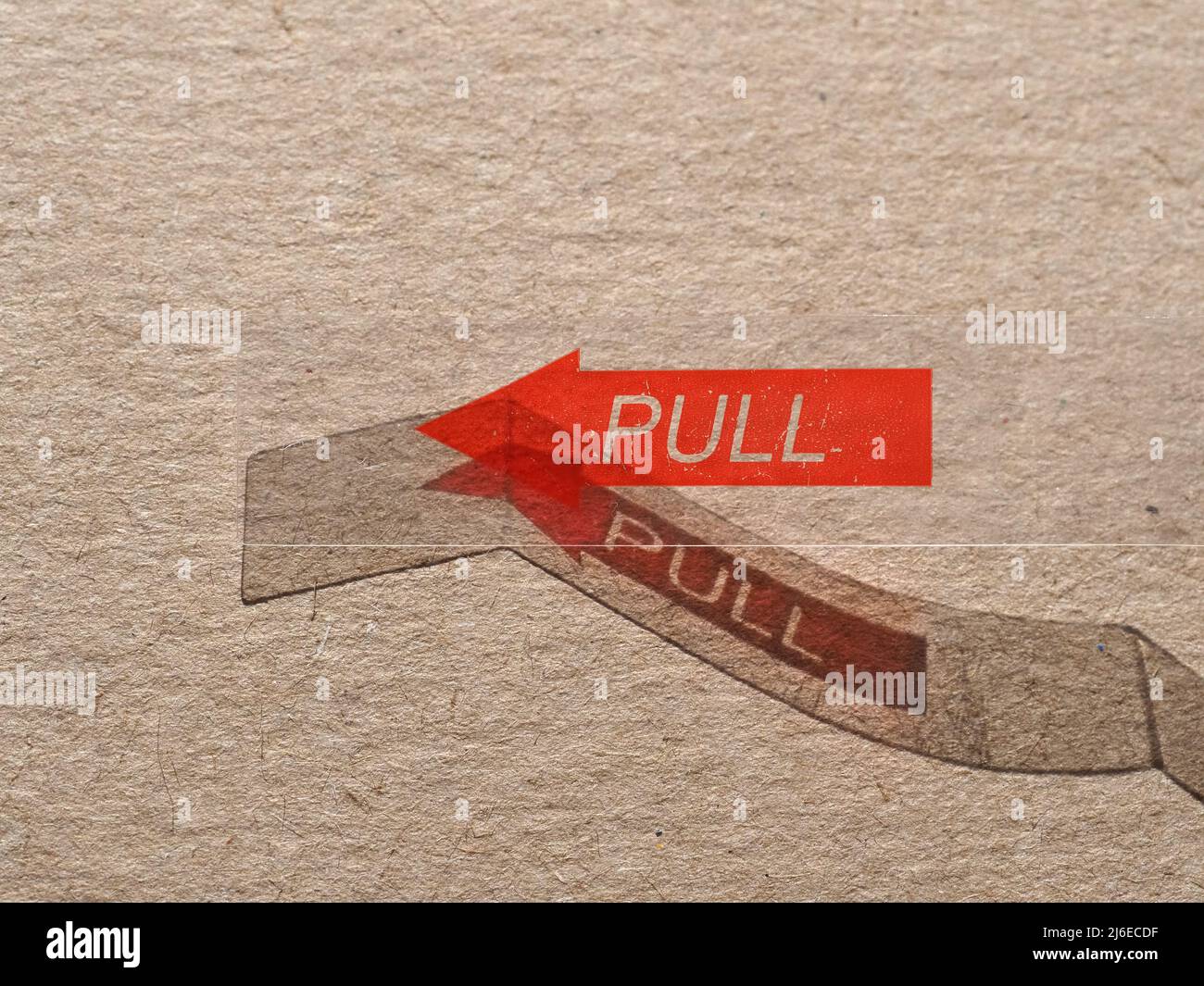 pull label with red arrow indicating direction Stock Photo Alamy