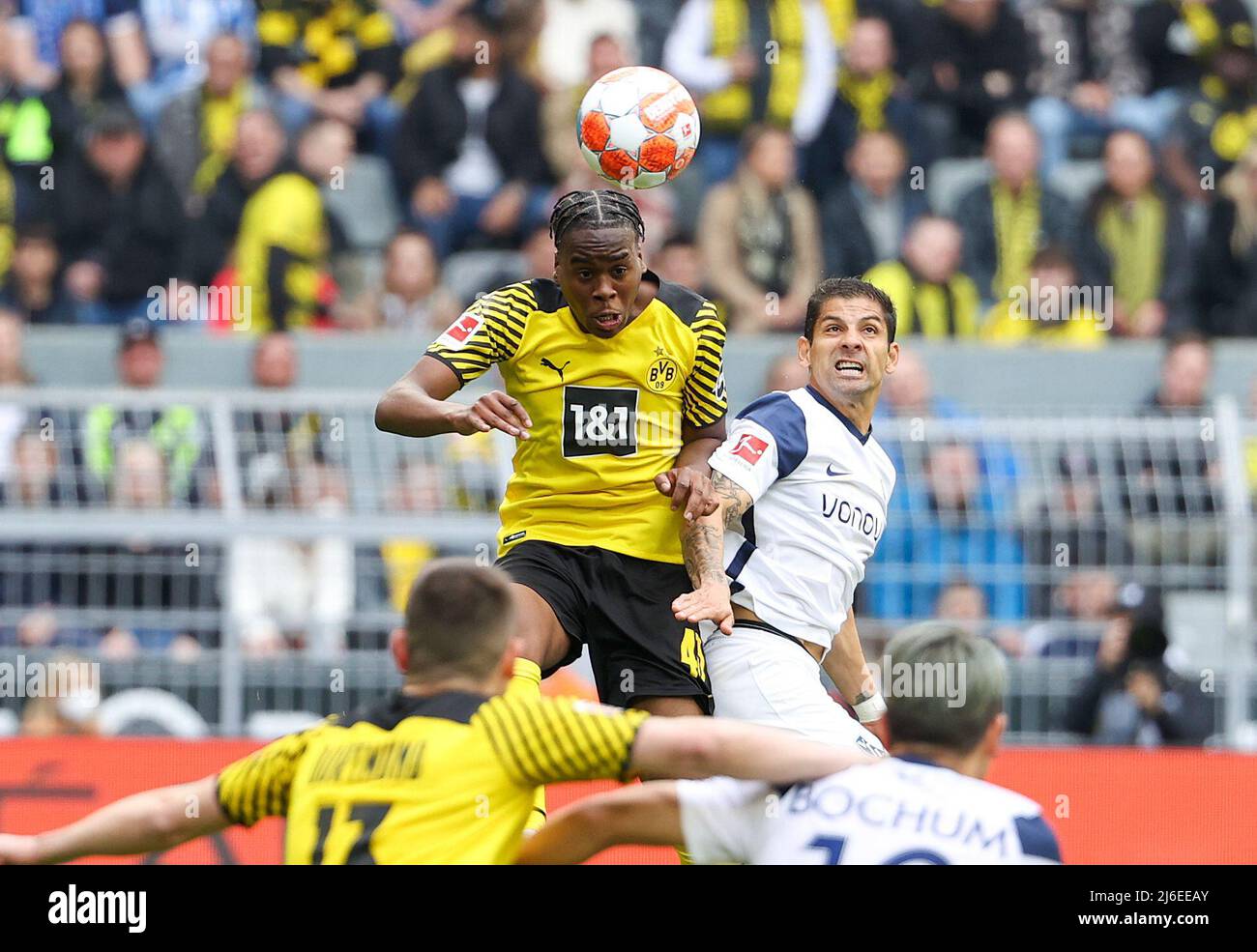 (220501) -- DORTMUND, May 1, 2022 (Xinhua) -- Jamie Bynoe-Gittens (L top) of Dortmund vies for header with Christian Gamboa of Bochum during the German first division Bundesliga football match between Borussia Dortmund and VfL Bochum 1848 in Dortmund, Germany, April 30, 2022. (Photo by Joachim Bywaletz/Xinhua) Stock Photo