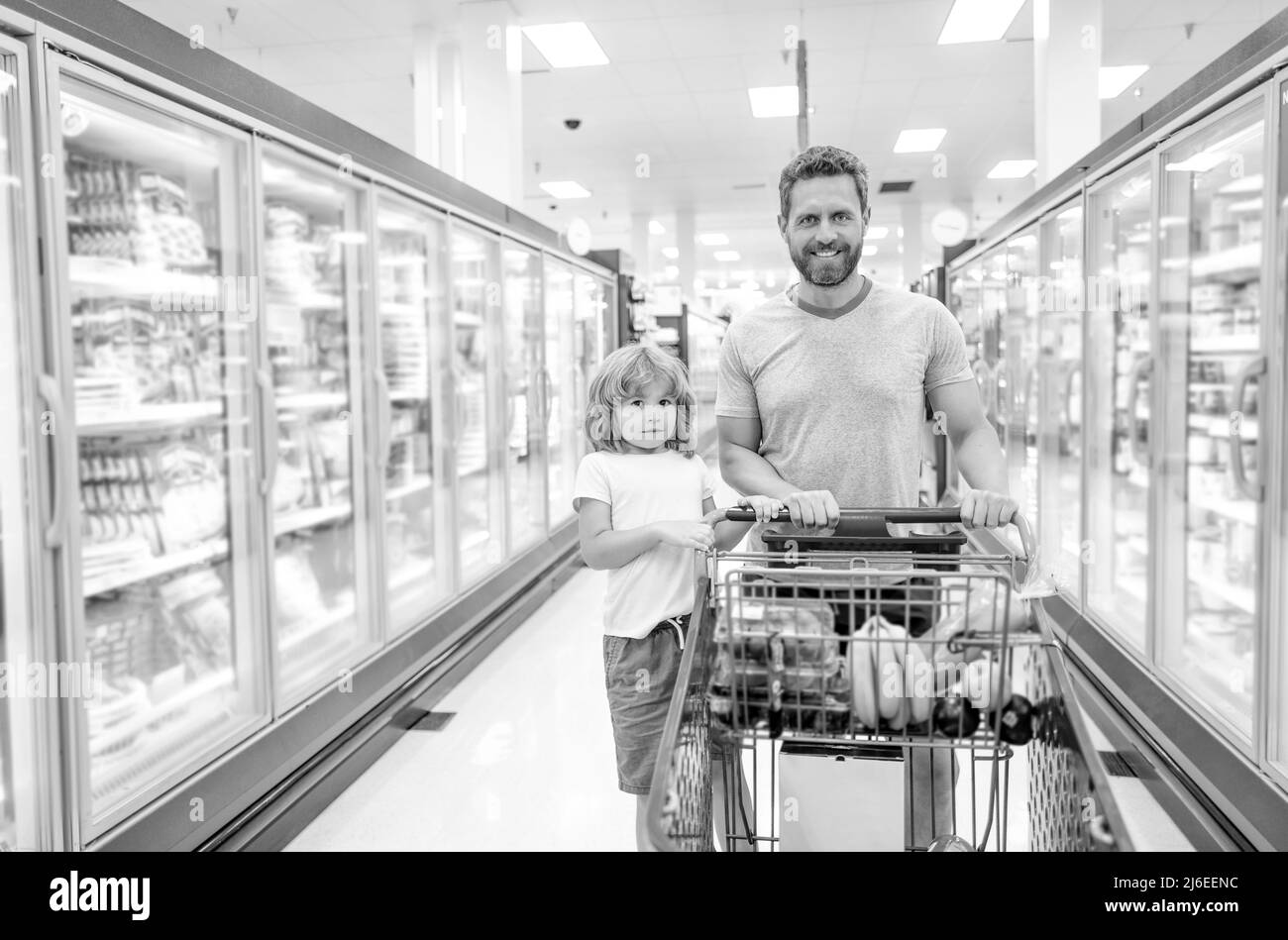 father and son with shopping cart. customer consumer with purchases. Stock Photo