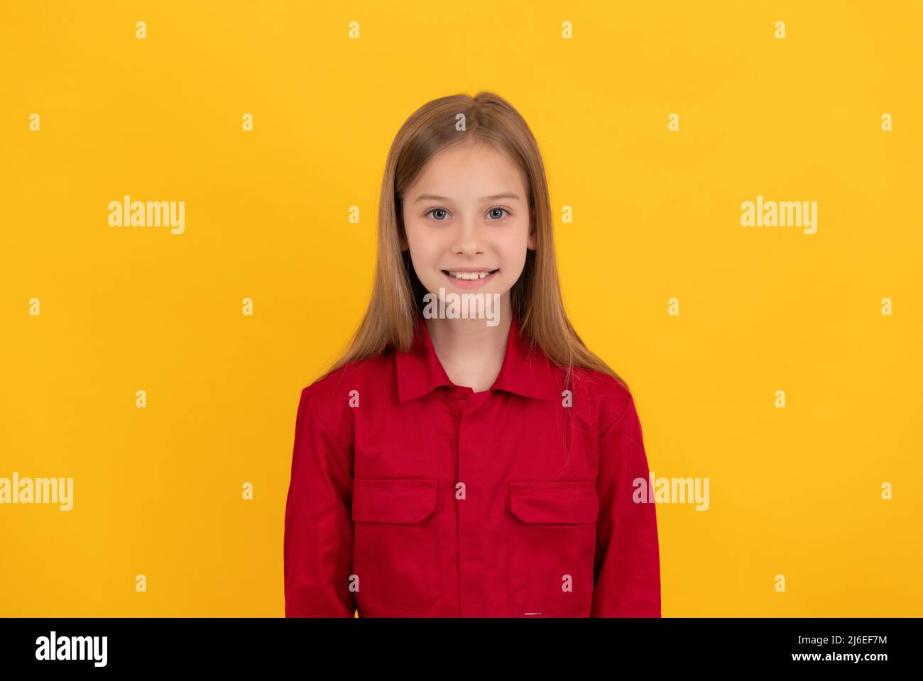 happy teen kid with cute face on yellow background Stock Photo